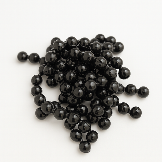 Pile of black trout eggs on a white background