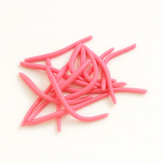 Pink fishing lures on a white background