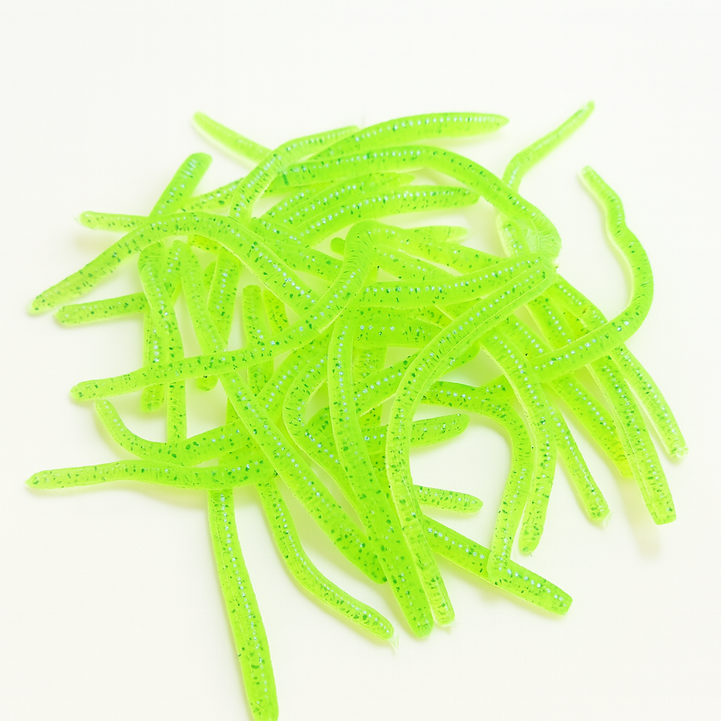 Bright green fishing lures on a white background