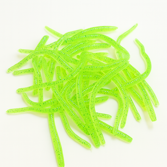 Bright green fishing lures on a white background