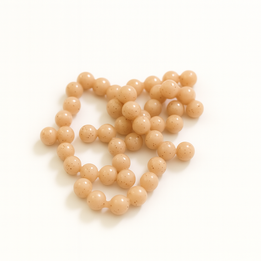 Beige trout eggs on a white background