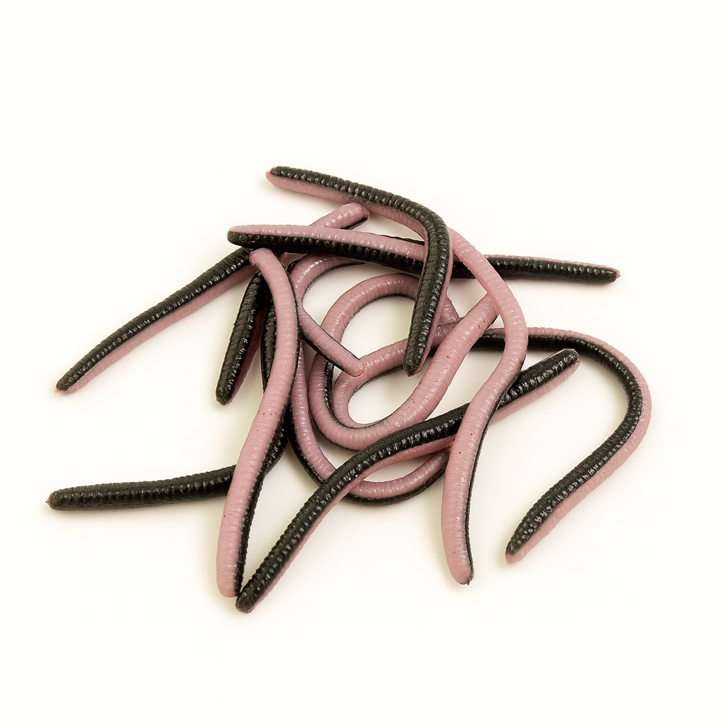 Pink and black fishing lures on a white background
