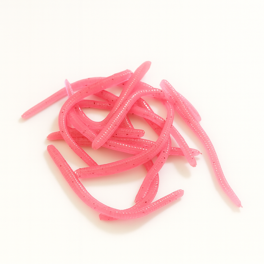 Pink fishing lures on a white background